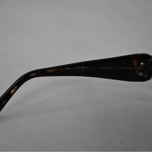 VersaceMOD 2126 1002/13
Gold with Tortoiseshell Arms
Brown gradient - Picture 5 of 9